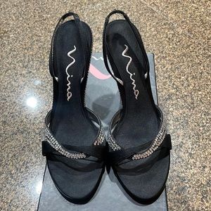 Black heel with sparkly diamonds around front & back. Nina heel